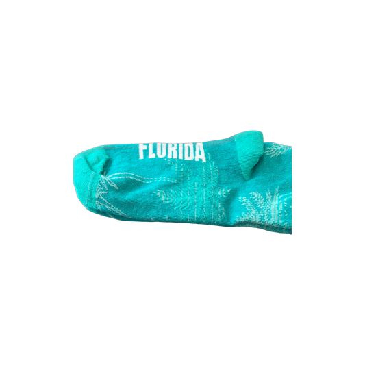 Green socks with Celebration, Florida logo