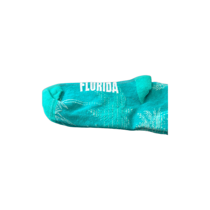 Green socks with Celebration, Florida logo