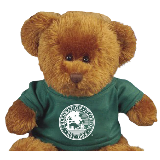 Plush teddy bear wearing a green t-shirt with a white Celebration, Florida circular logo