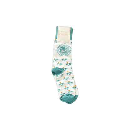 White socks with palm tree pattern and Celebration Florida logo