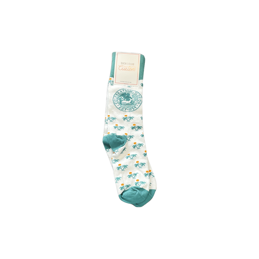 White socks with palm tree pattern and Celebration Florida logo